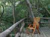 Relax on the wooden deck, Phophonyane Lodge